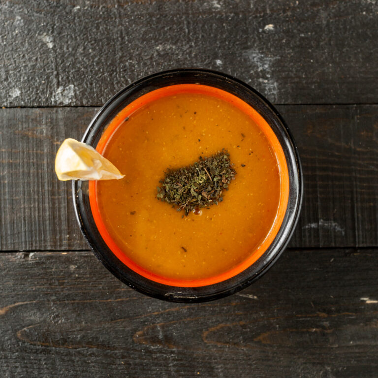 top-view-lentil-soup-garnished-with-dried-mint-leaves-lemon