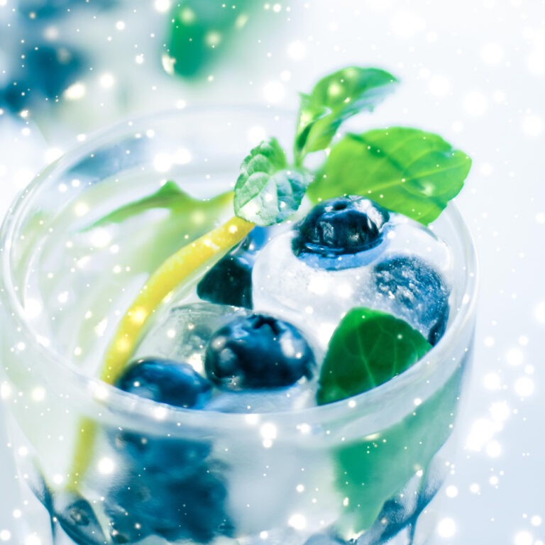 winter-holiday-cocktail-with-ice-glowing-snow-background-christmas-time-menu-recipe